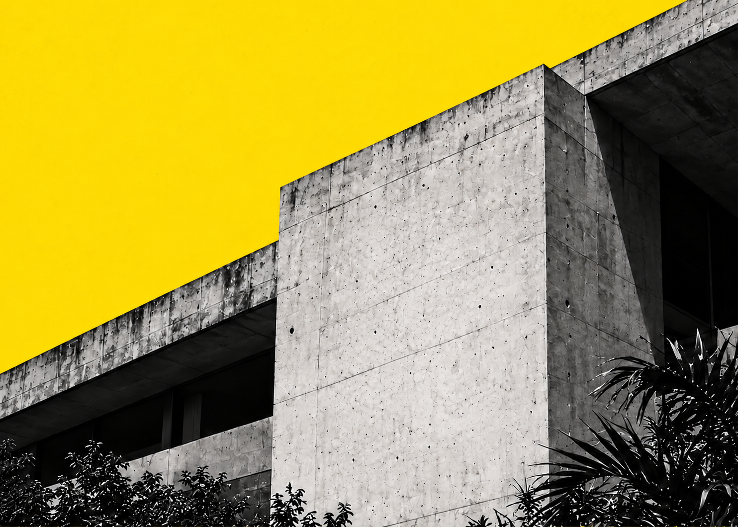 Fachada de concreto brutalista sob um plano amarelo.